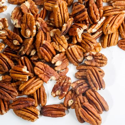 View full size image shelled pecans on table