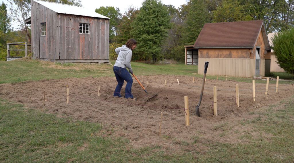 Loosening soil with a rake